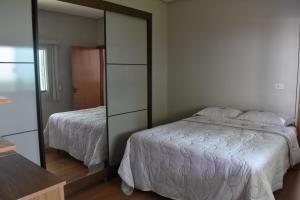 Postel nebo postele na pokoji v ubytování Casa aconchegante com piscina
