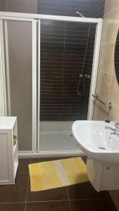 a bathroom with a sink and a toilet and a shower at Baltar in Sanxenxo +8 photos