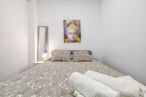 En eller flere senge i et værelse på Aires de Azahar & Parking Incluido