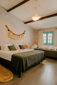 Katil atau katil-katil dalam bilik di Pousada Boutique Preá Beira Mar - Raro Life
