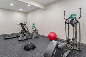 a gym with three exercise bikes and a red ball at Holiday Inn Express Pittsburgh - Munhall by IHG in Munhall