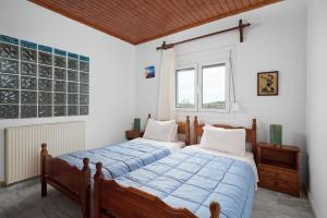 Katil atau katil-katil dalam bilik di Seaside House