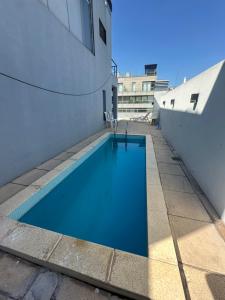 a swimming pool on the roof of a building at Foster Studio - Nicaragua in Buenos Aires