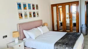 a bedroom with a bed with white pillows at I love Marina Greenwich, Altea in Altea