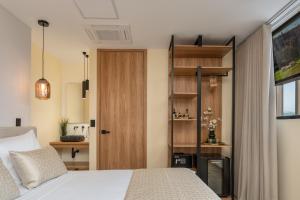 A bed or beds in a room at LIN Boutique Hotel by HOUSY HOST