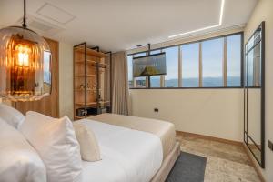 A bed or beds in a room at LIN Boutique Hotel by HOUSY HOST