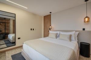 A bed or beds in a room at LIN Boutique Hotel by HOUSY HOST