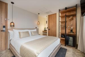 A bed or beds in a room at LIN Boutique Hotel by HOUSY HOST