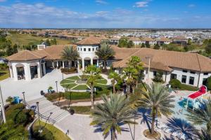 an aerial view of a house with palm trees at 4BD/3BA Champions Gate Home With Private Pool in Davenport