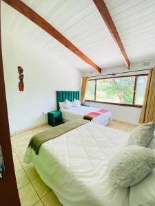 Una cama o camas en una habitación de Isina Mova