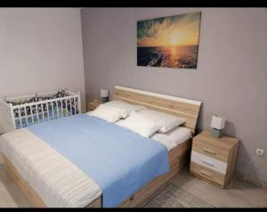 Postel nebo postele na pokoji v ubytování Apartman Nino