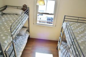 Voodi või voodid majutusasutuse The Hive Hostel - Traveler Friendly, Passport Only toas