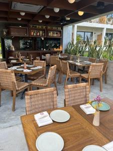 a restaurant with tables and chairs and a bar at Witari Hotel Boutique in San Francisco