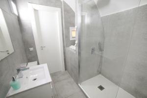 a bathroom with a shower and a sink at Casa Sant Anna in Naples