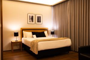 Cama ou camas em um quarto em Mercure Belo Horizonte Savassi