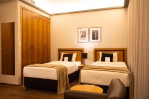 Cama ou camas em um quarto em Mercure Belo Horizonte Savassi