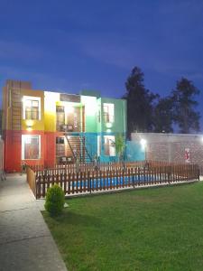 a building with a fence in front of a yard at Complejo Don Tito in San Juan +75 photos