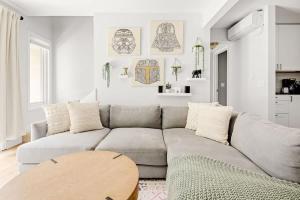 a living room with a couch and a table at Bright & Modern - King Suite - Creekside Trail in Boulder