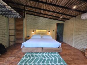 Voodi või voodid majutusasutuse Hamadryade Lodge toas