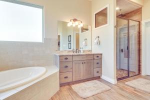 a bathroom with a tub and a sink at Scenic Views, Fire Pit Texas Hill Country Getaway in Fischer +26 photos
