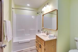 a bathroom with a shower and a sink and a mirror at Quiet Oakland City Studio Walk Downtown! in Oakland City +18 photos
