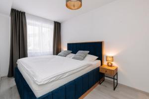Postel nebo postele na pokoji v ubytování Apartmán 12 - Rezidence K Lanovce