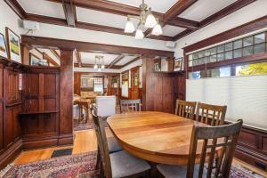 a dining room with a wooden table and chairs at 726 Fourth Historic Wortman House in McMinnville