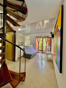 a living room with a couch and a table at Hotel Torre Primavera in Medellín