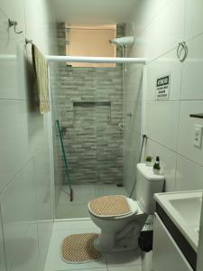 a bathroom with a shower with a toilet and a sink at Bella Morena 1 Ilha de Boipeba in Ilha de Boipeba +11 photos