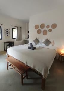 Ένα ή περισσότερα κρεβάτια σε δωμάτιο στο Origen Bungalows & Yoga Shala