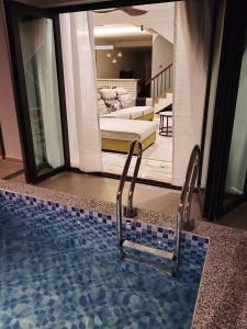 a view of a swimming pool in a house at D Laman Santai 17Pax 5R4B Near TC Beach in Kuantan