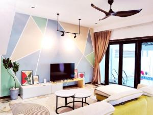 a living room with a whale painted on the wall at D Laman Santai 17Pax 5R4B Near TC Beach in Kuantan