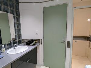 a bathroom with a sink and a shower backdoor at Gîte 75m² avec WIFI et animaux acceptés à Montmédy - FR-1-585-23 in Montmédy