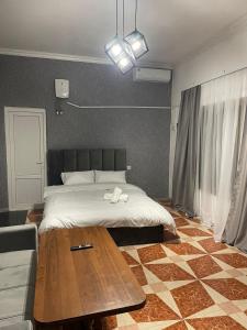 Ένα ή περισσότερα κρεβάτια σε δωμάτιο στο Prime Hotel