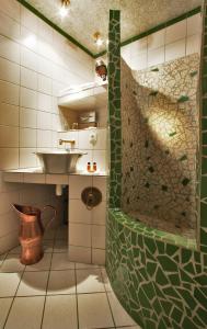 a bathroom with a sink and a shower at Relais du Bois Saint Georges - Hôtel de Charme in Saintes