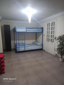 a room with two bunk beds in it at AFB Hostel in Alexandria