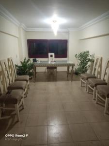 a conference room with a table and chairs in it at AFB Hostel in Alexandria