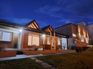 a house at night with lights on at Ventanas de la Patagonia 3 in Esquel