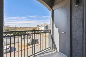a balcony with a door and a view of a street at Frisco Business Class, Modern Executive Suite in Frisco