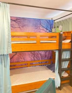 Postel nebo postele na pokoji v ubytování Minato Hostel