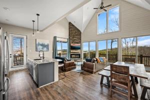 a kitchen and living room with a table and chairs at Mountain Lake Escape in Dandridge
