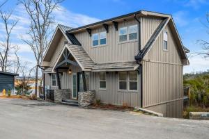 a house with a gambrel roof at Mountain Lake Escape in Dandridge