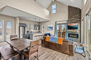 a kitchen and living room with a couch and a table at Mountain Lake Escape in Dandridge