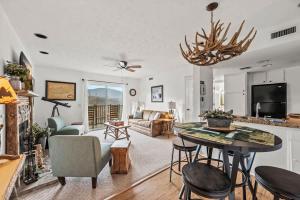 a kitchen and living room with a table and chairs at Little Cub in Gatlinburg