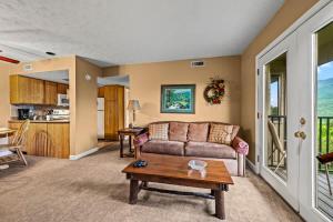 a living room with a couch and a table at Rocky Top Oasis in Gatlinburg