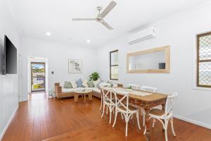 a dining room with a table and chairs at Perfect Cooee Bay Beach Getaway! in Yeppoon