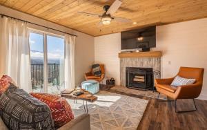 a living room with a couch and a fireplace at Morning Vista in Gatlinburg