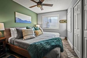 a bedroom with a bed and a ceiling fan at Hesed Mountain Haven in Gatlinburg