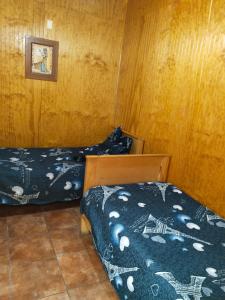 Voodi või voodid majutusasutuse Hostal Cactus Copiapo toas