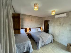Postel nebo postele na pokoji v ubytování Casa Ada - Miracles